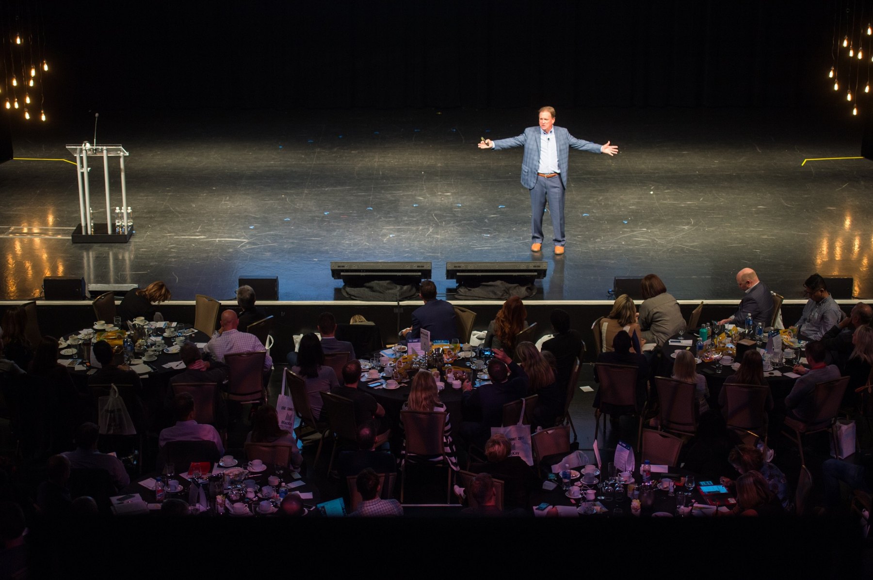 Jim Carroll on stage with an executive audience